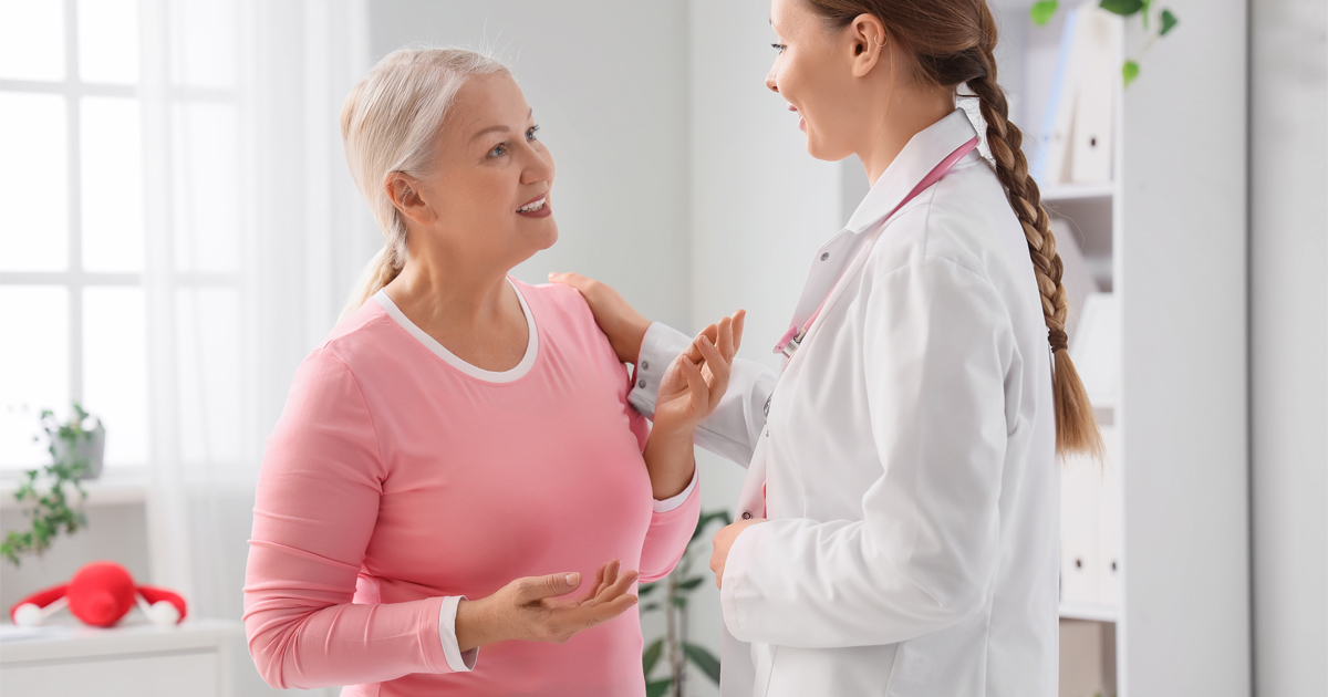 woman discussing hormone therapy for menopause symptoms with healthcare provider