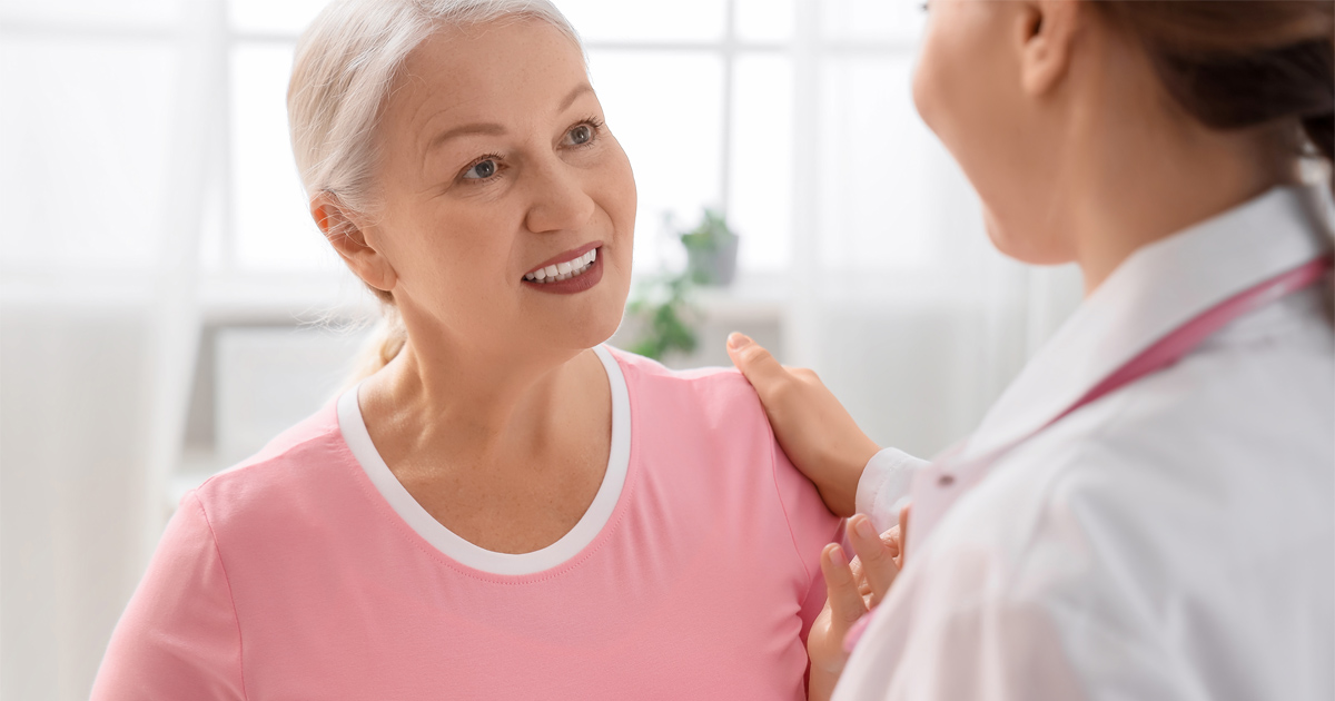 Woman learning about hormone therapy for women over 40 and menopause wellness support