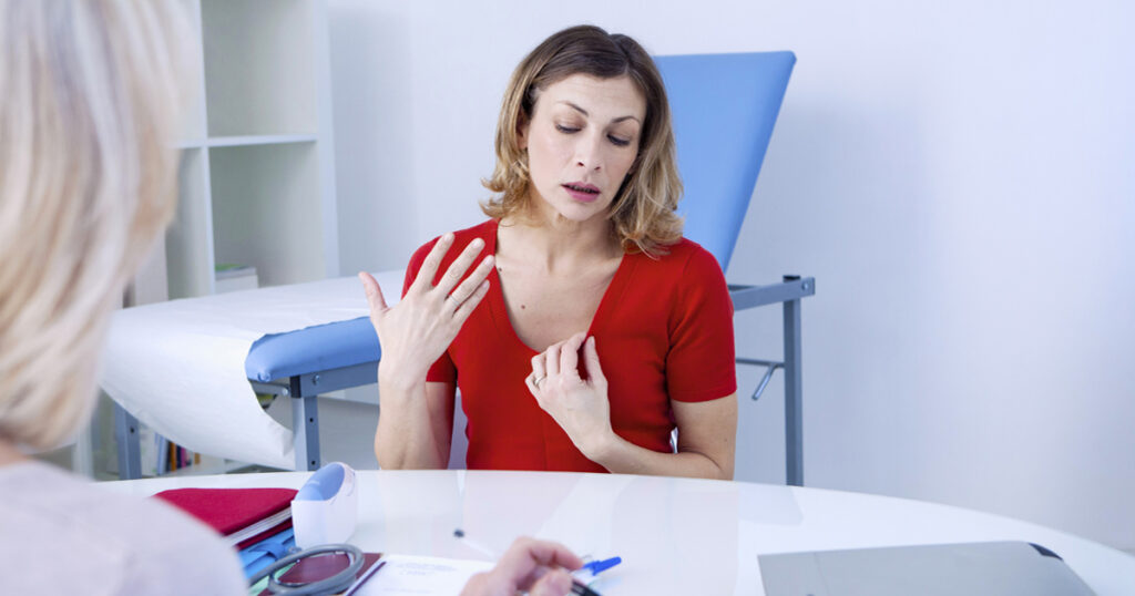 Woman discussing Menopause Hormone Therapy with a healthcare provider during a personalized consultation